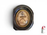 a clock with a picture of a man in a hat on it