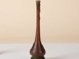 two vases that are sitting on a table