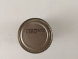 a close up of a can of food on a white surface