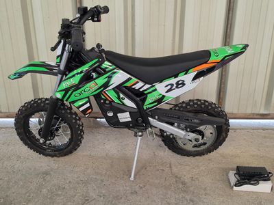 a dirt bike parked in front of a building