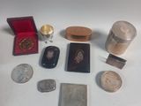 a lot of silver and gold items on the table