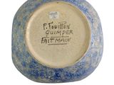a blue and white bowl with writing on it