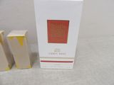 packaging of a white candle with a red box on a table