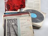 an assortment of records including a record, a record case and a record
