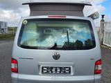 a silver van that is parked on the side of the road