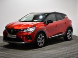 une voiture rouge garée dans une pièce au sol en damier