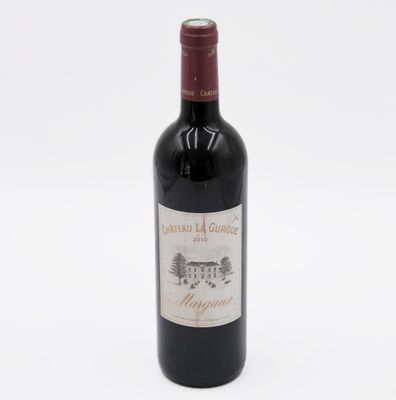 a bottle of wine that is sitting on a table