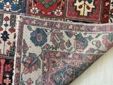 a close up of a rug with a pair of scissors next to it