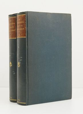 two books sitting on top of each other on a white surface