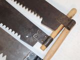 two saws that are sitting next to each other on a table