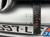 a close up of a car ' s front bumper with a ruler on it