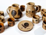 a lot of cups and saucers that are on the table