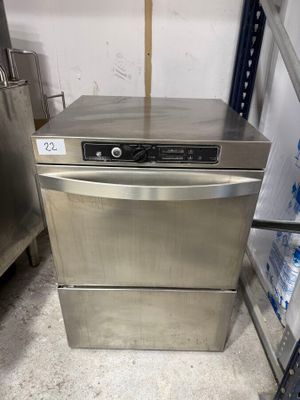 a dishwasher that is sitting in the middle of a room