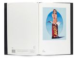 an open book with a picture of a woman in a bikini on top of a chocolate bar