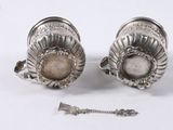 pair of silver plated cuff earrings with a stone in the center