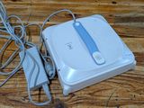 a wii game system sitting on a wooden table