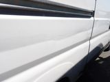 a white van parked on the side of the road