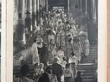 a black and white photo of a group of people walking down stairs