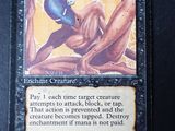 a close up of a card with a picture of a creature on it