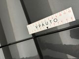 a sticker that says quality on the side of a refrigerator