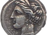 une pièce d'argent portant une tête de femme