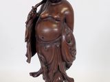 an image of a statue of a man with a bag on his back