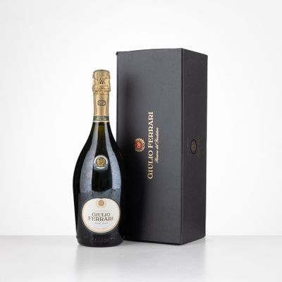 a bottle of champagne in front of a black box