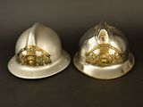 two helmets that are sitting next to each other