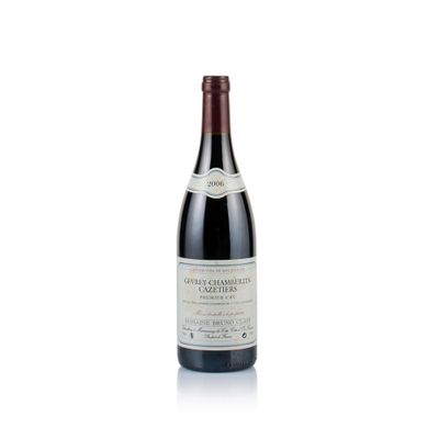 a bottle of wine that is sitting on a white surface