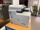 a printer sitting on top of a table in a room
