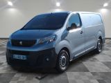 the silver van is parked on a checkered floor in a room