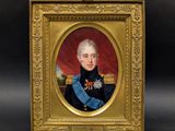 portrait of a man in uniform in a gold frame on a black background