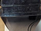 a small black machine sitting on top of a counter