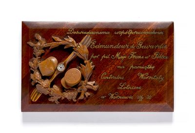 wooden plaque with a picture of a bear and a bird on it