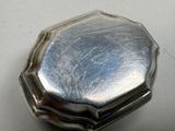 a silver box that is sitting on a table