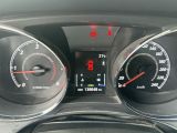 a close up of a car dashboard with a speedometer and gauges