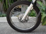 a close up view of a motorcycle tire on the street