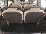 two seats in the back of a car that is empty
