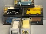 several different model vehicles are displayed in a display case