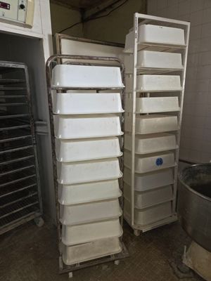 many bins that are stacked up in the kitchen