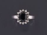 a black diamond and diamond cluster ring