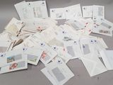 a pile of mail sitting on a table next to a pair of scissors
