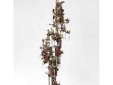 a sculpture of a tall tower with a clock on top of it