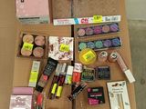 a lot of cosmetics and makeup products on a table