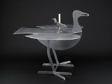 two birds that are sitting on a table