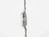 a clock that is on a pole in the middle of a field