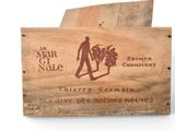 a wooden box with a picture of a man holding a bunch of grapes