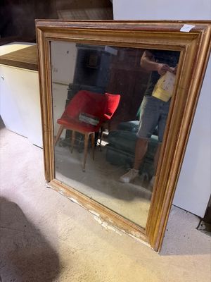 a man taking a picture of himself in a mirror