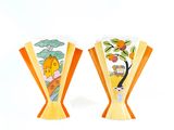 two vases that have been painted with animals on them