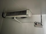 an air conditioner hanging from the ceiling in a room